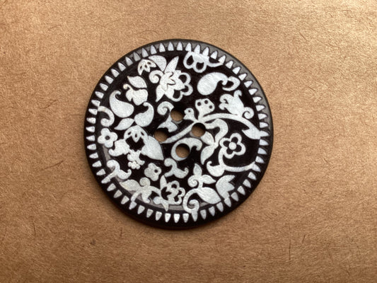 Black mosaic button